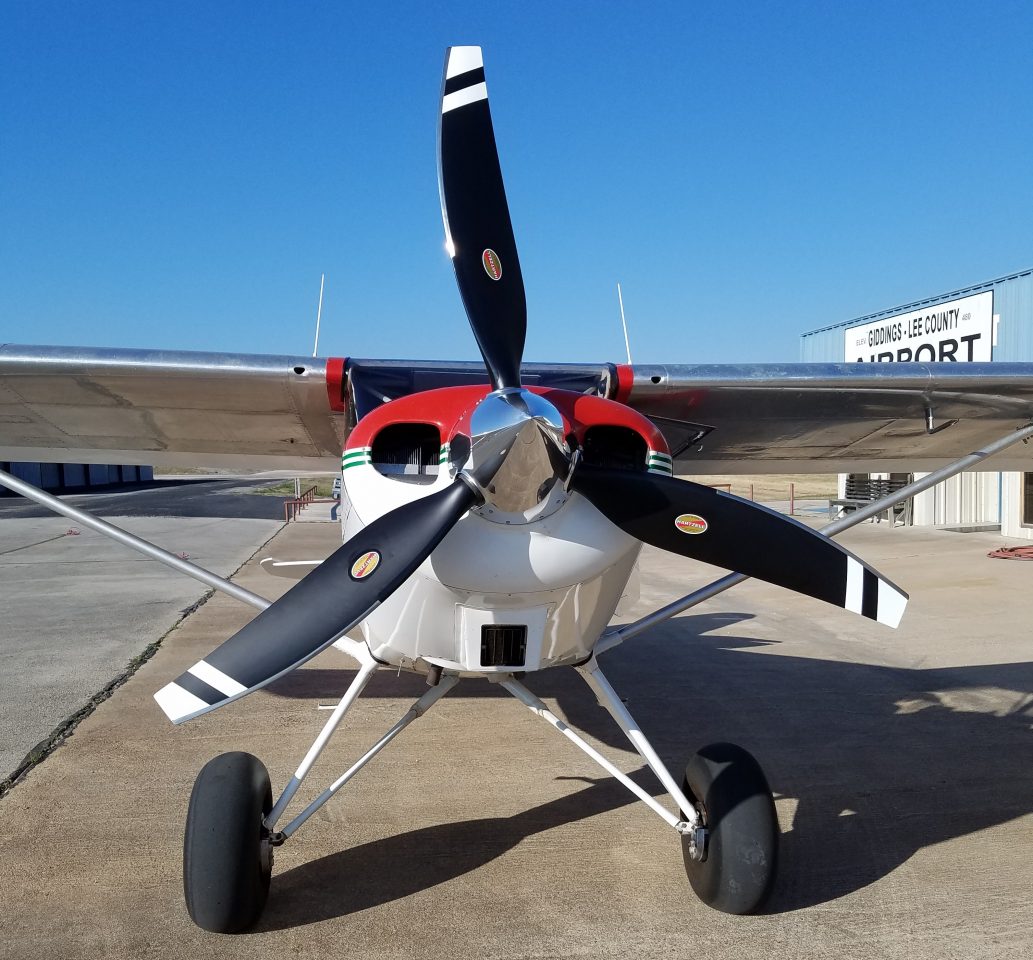 Front view of Bearhawk aircraft with three-blade Hartzell propeller