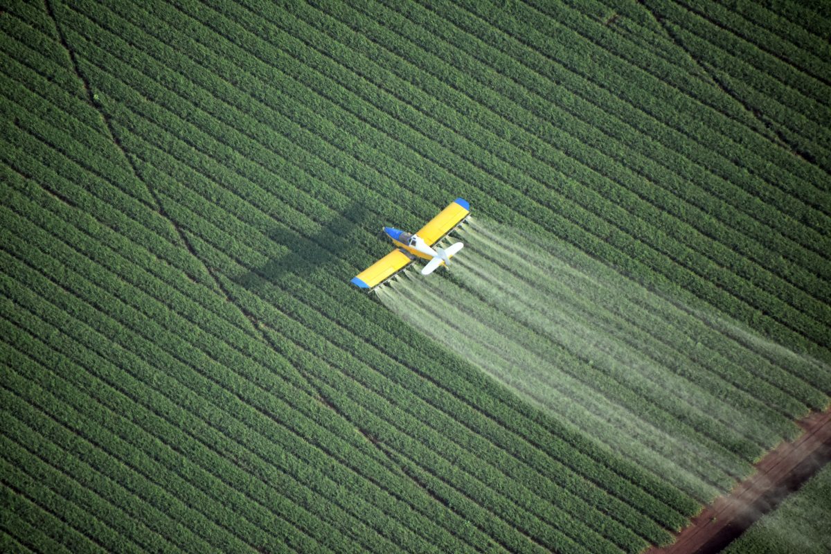 Looking down on a crop duster, agricultural plane