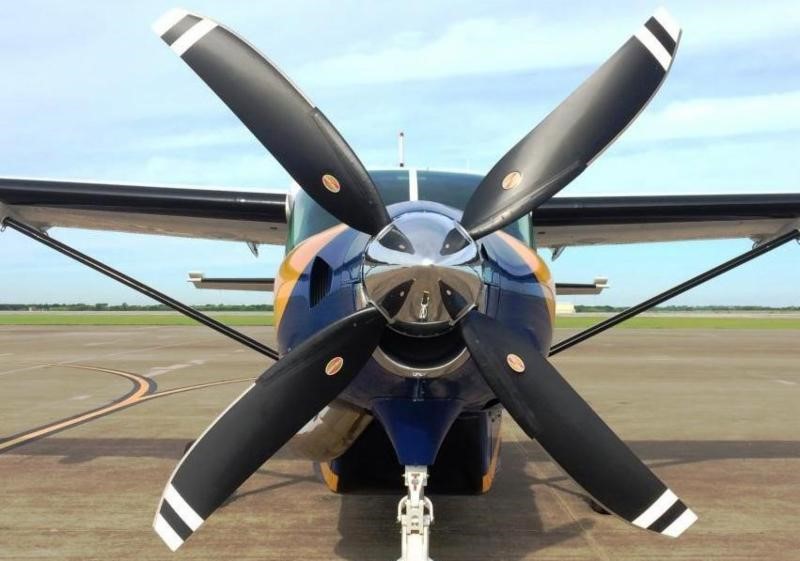 Front view of a Supervan aircraft with 4-blade Hartzell propeller