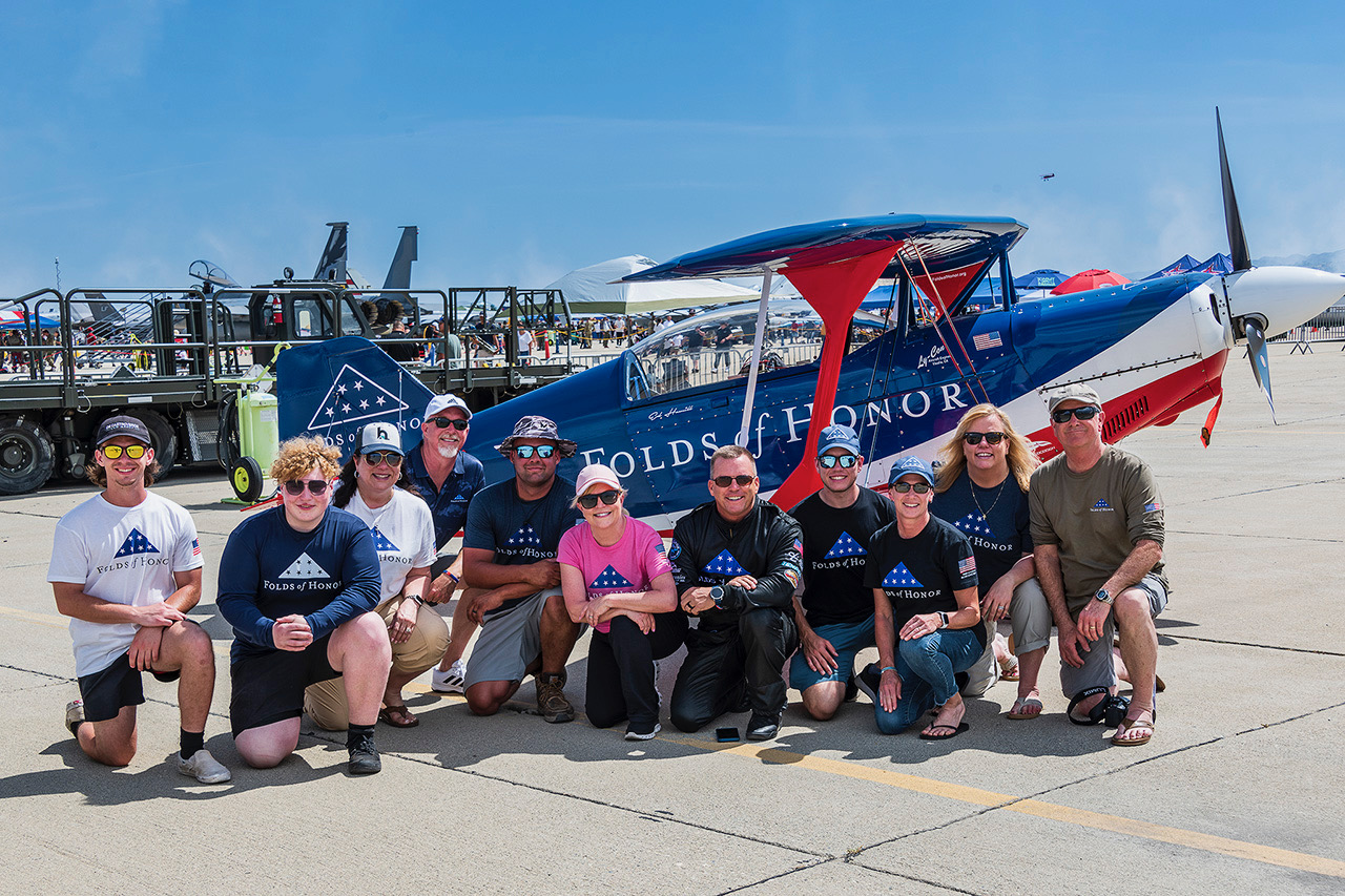 Ed Hamill Folds of Honor Biplane with crowd at airshow